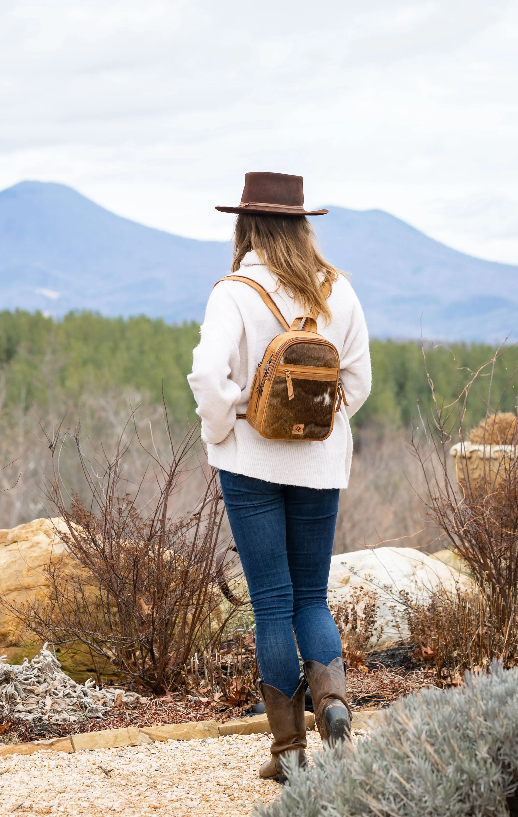 Daisy | Leather Concealed Carry Backpack or Sling | Hair-On Cowhide Accent | Locking Exterior Concealment Pocket | Travel or Commuting Bag