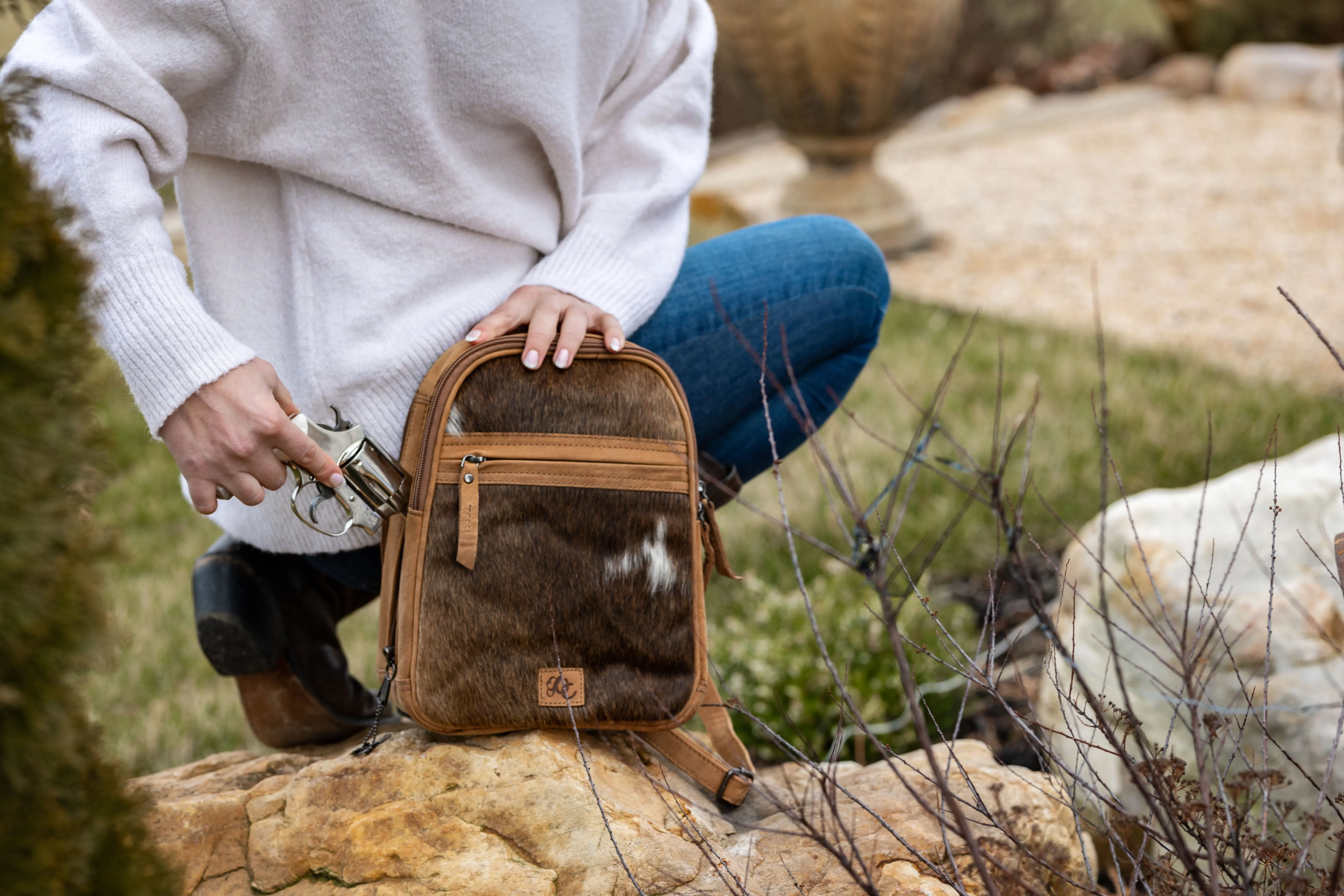 Daisy | Leather Concealed Carry Backpack or Sling | Hair-On Cowhide Accent | Locking Exterior Concealment Pocket | Travel or Commuting Bag