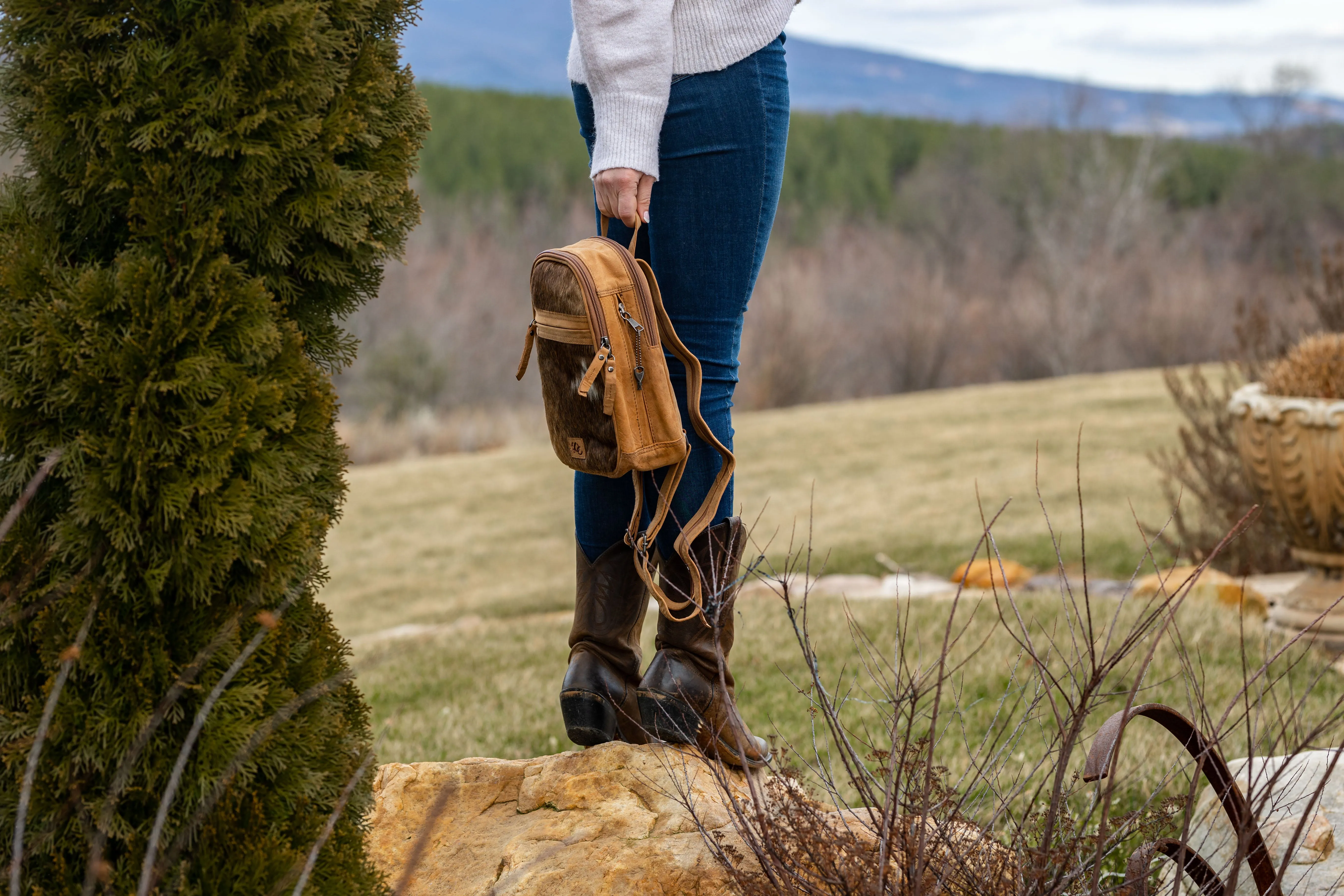 Daisy | Leather Concealed Carry Backpack or Sling | Hair-On Cowhide Accent | Locking Exterior Concealment Pocket | Travel or Commuting Bag